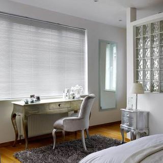 Sheer Luxury Brushed Mercury Venetian blinds in a glamorous bedroom