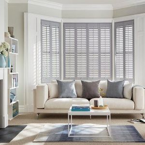 Grey full height shutters in the living room