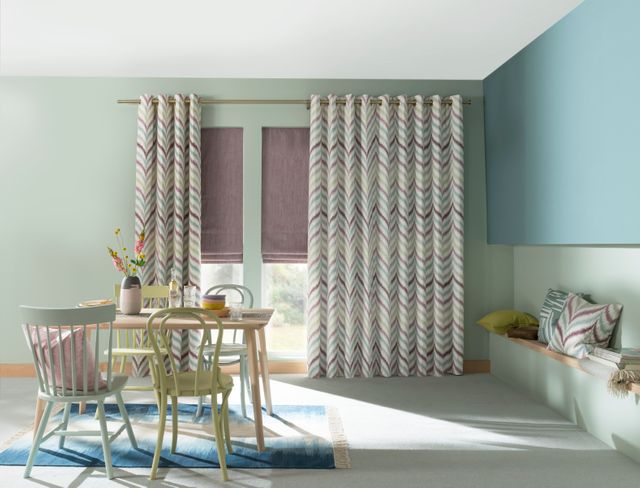 Made to Measure Souk Berry Haze curtains in a lounge setting