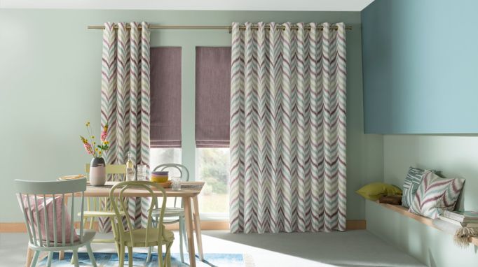 Made to Measure Souk Berry Haze curtains in a lounge setting