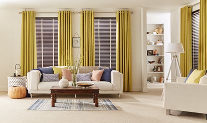 Light and cosy Living Room with plain Yellow Curtains and dark wood venetian blinds