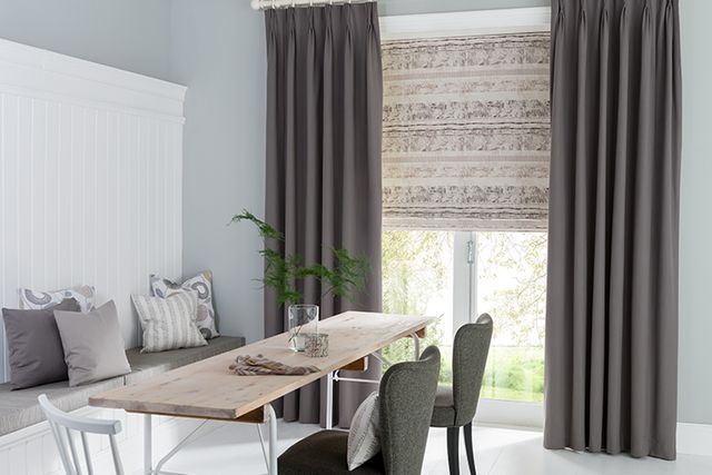 Grey coloured tetbury charcoal curtain in a white decorated dining room