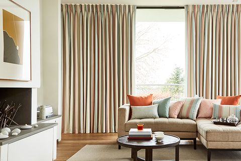 Inviting and cosy Living Room with neutral decor and Pinch Pleat Curtains in Mishima Dawn fabric