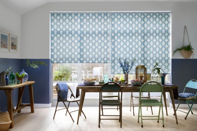 denim blue and white roman blinds in dining room with chairs and table with food displayed on it
