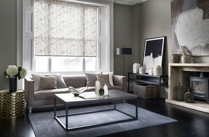 Formal living room with a grey floral roller blind