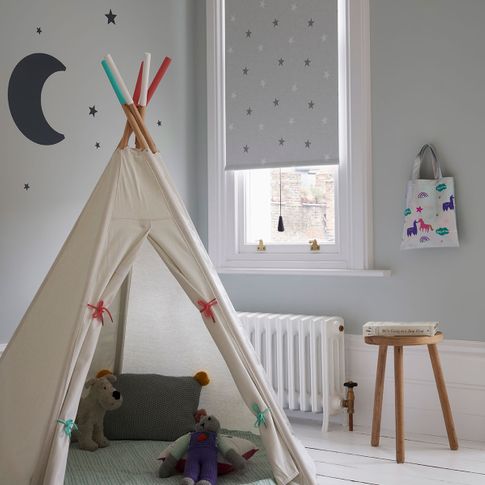 Children's room with a Patterned Roller Blind in twinkle star fabric