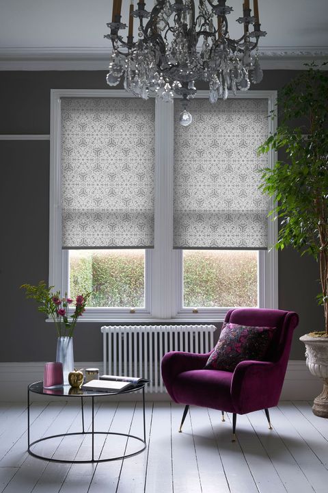 Traditional chic living room with sash windows dressed with grey roller blinds