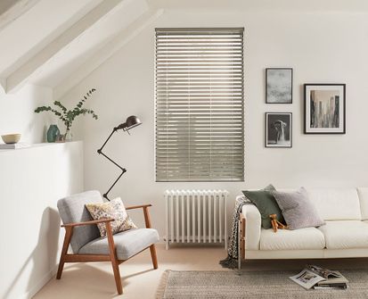 Modern minimalist living room with silver Venetian blinds