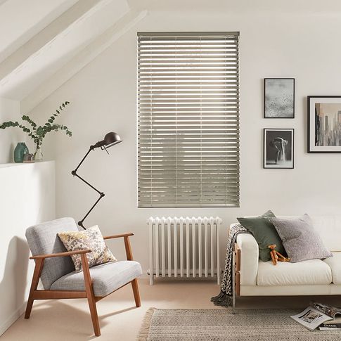 Modern minimalist living room with silver Venetian blinds