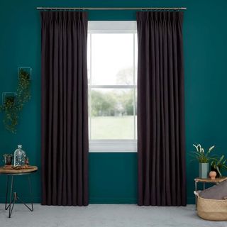 Abigail Ahern Garratt Cloak Curtains set against teal walls
