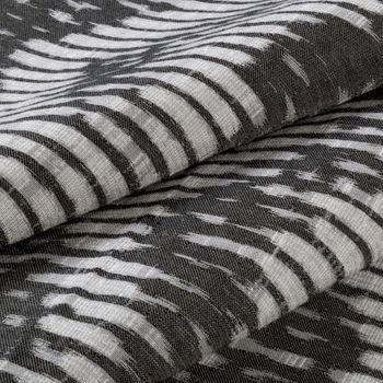 Black and white striped Cadillac Noir swatch on a ream of fabric 