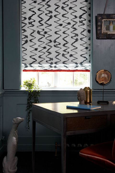 Wolfe Smoulder Roman blind fited to a window in a study room