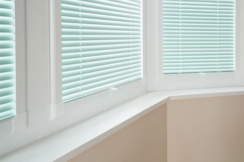 Close up of perfect fit blinds in pastel green fabric