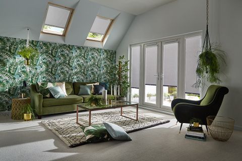 Living room with tropical design and patio doors dressed with grey perfect fit blinds