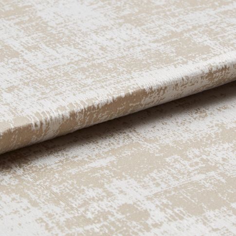 Beige coloured fabric that is layered with a silver layer in a textured style