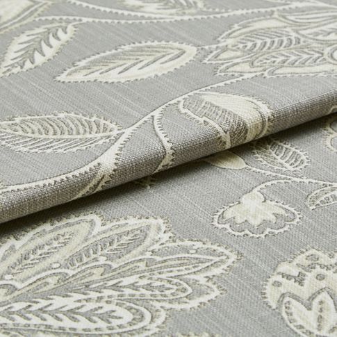 Grey coloured roman blind fabric which has an intricate leaf and stem design woven into the material in a white colour 