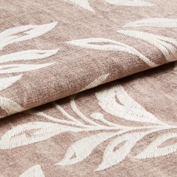 Light brown fabric with a repeating floral pattern on the material