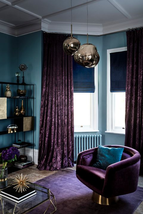 Radiance Midnight Roman blinds with Broadleigh Aubergine curtains hung in an opulent living room
