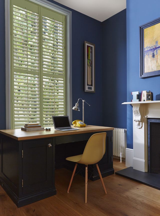 Green custom colour shutters in a home office