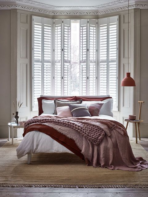 Full height Silk White shutters in a bedroom