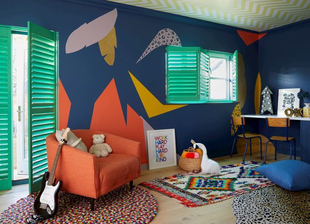 A vivid child's playroom fitted with bright green shutters