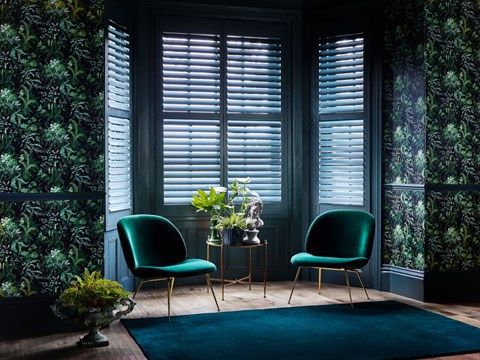 Custom colour shutters in blue in living room
