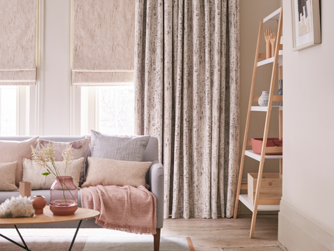Cosy pastel colour living room with luxury pink velvet curtains