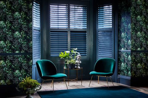 Green custom colour shutters in a living room