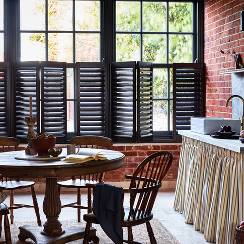 Grey cafe-style shutters in kitchen