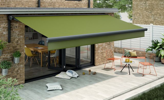 Large dark green awning covering a patio
