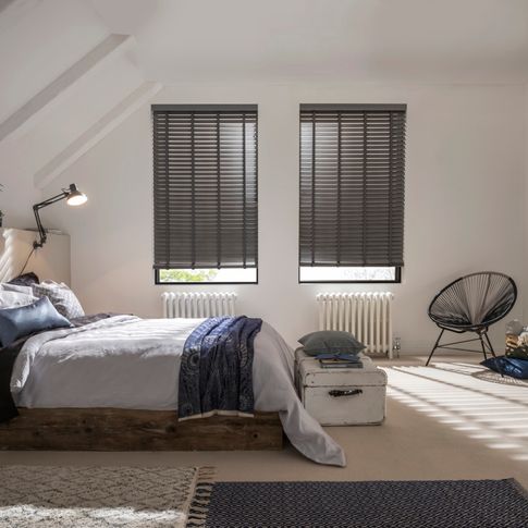 Bedroom with two windows fitted with Wooden blinds in Lunarre Faux Wood