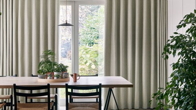 Rustic dining room with wave header full length green curtains