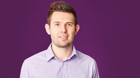 Head and Shoulders photo of someone against a purple background
