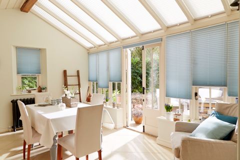 Light and spacious dining area with Aqua Pleated Conservatory Blinds
