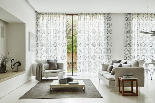 White Interior Living Room with White Patterned Voile Curtains in Swirl Dusk Fabric