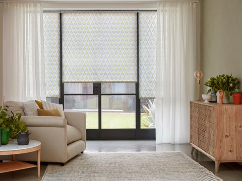 Crystal Ecru Voile curtains and Petula Olive curtains in living room