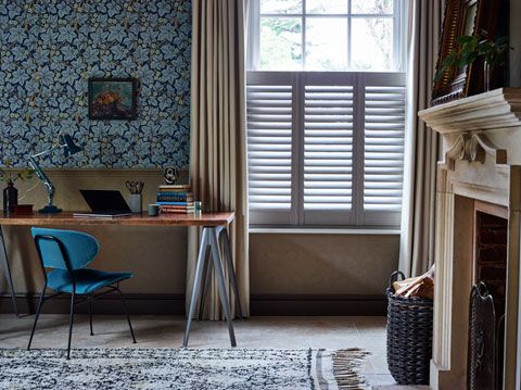 Cafe style shutters layered with full length curtains