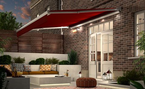 Outdoor entertaining space covered by garden awning