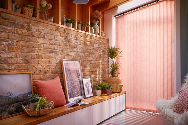 coral vertical blinds in a patio window 