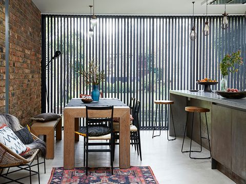 Kitchen with wide glass window, fitted with Acacia Black verticals and Serene Linen Voile curtain