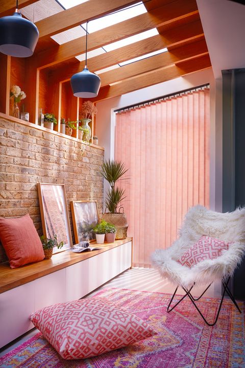 Modern colourful side conservatory with orange vertical blinds