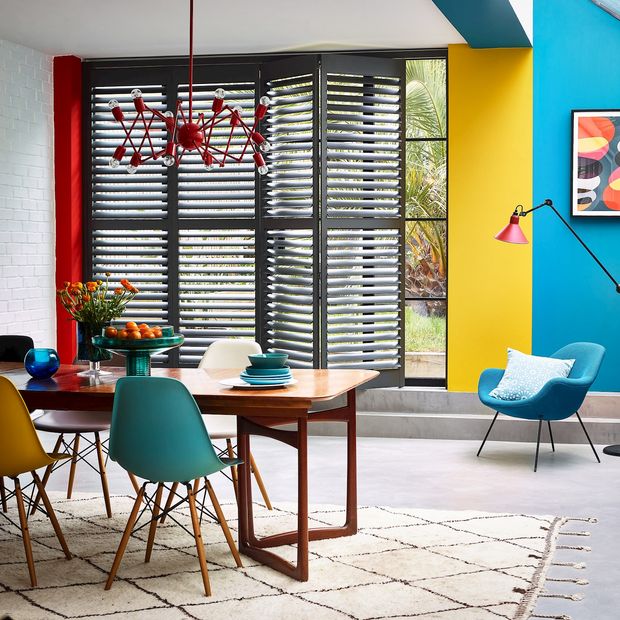 vibrant dining room with coloured shutters