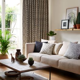 Rustic Living Room with plants and wooden furniture and full length Blackout Curtains for light control 