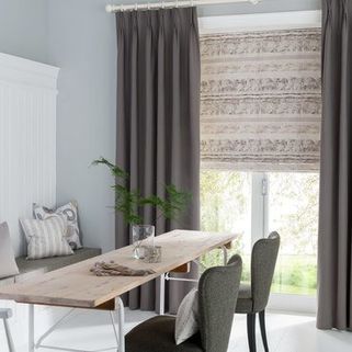 Tetbury Charcoal Curtains in dining room with wooden dining table and grey chairs