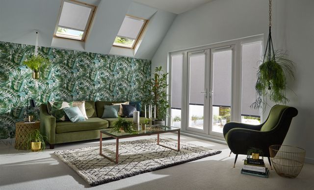 tropical theme room with acacia silver color roller blinds on patio door and skylight windows