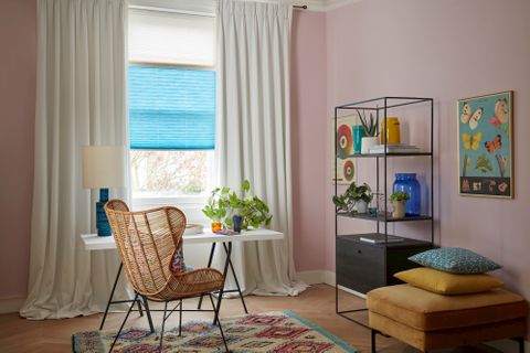 Colourful and artistic home office with blue thermal blinds