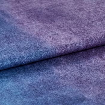 Folded fabric in a rich purple colour 