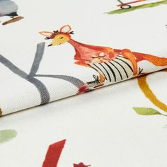A roll of fabric that is decorated with the letters of the alphabet and animals that matching each word