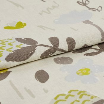 cream coloured fabric with repeating floral patterns in a a variety of colours including brown, grey, green and beige