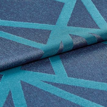 The base material is navy blue but the fabric also has a geometric design in a lighter shade of aqua blue